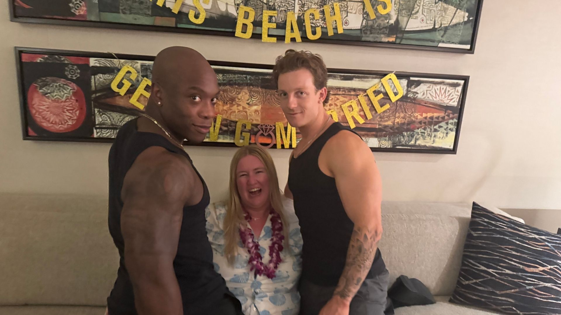 Two Trident Gents with a delighted client at a Hawaiian-themed bachelorette event